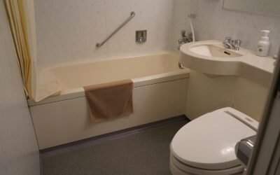 a bathroom with a tub sink and toilet